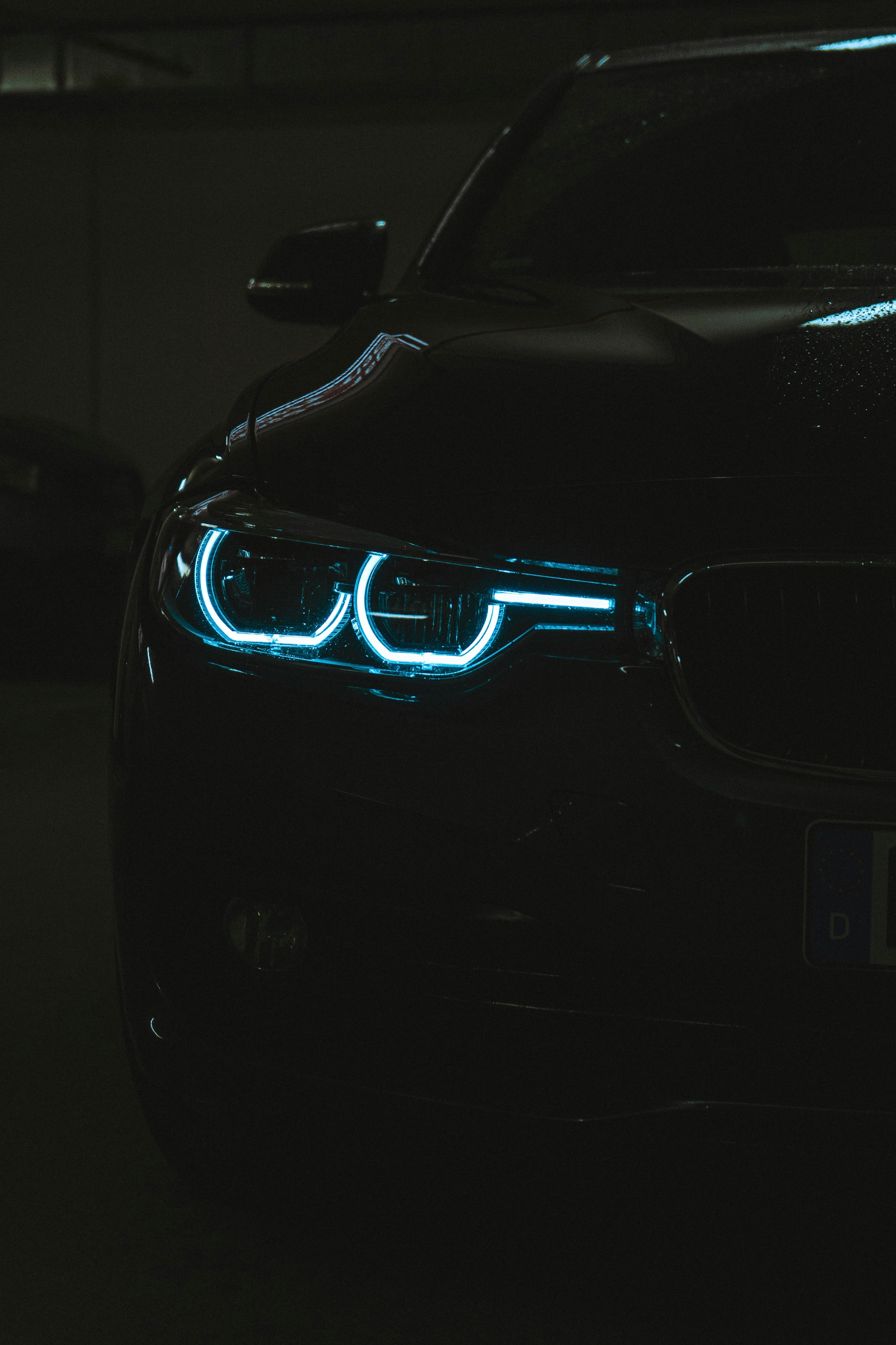 black bmw car in a dark room